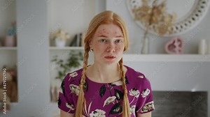 Young Beautiful Redhead Girl with Problem Skin Looks at the Camera Like in a Mirror. Acne treatment stages - 7th day of 28. Commercial ready woman skin care concept.