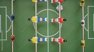 Friends Playing Table Soccer Game Closeup. People playing in table football or kicker with miniature players. Slow Motion. Shallow DOF. Playing Football Soccer on game table. Close Up.