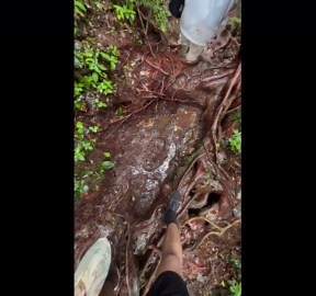 Hiker face plants on muddy trail and leaves imprint on ground