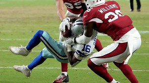 Reggie Davis goes up between two defenders for strong 32-yard grab