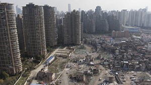 127K views · 528 reactions | As massive skyscrapers rise up in Shanghai, some residents are resisting the demolition of their homes. The construction continues around them. #Daily360 | The New York Times | Facebook