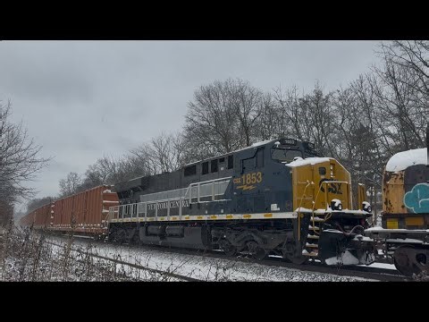 CSX 3044 ES44AH leads CSX M409 with CSX 1853 New York Central Trailing as mid dpu at Piscataway 