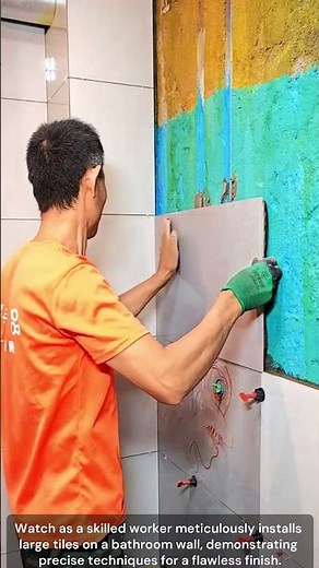 The process of Tiling a Bathroom Wall with Large Tiles