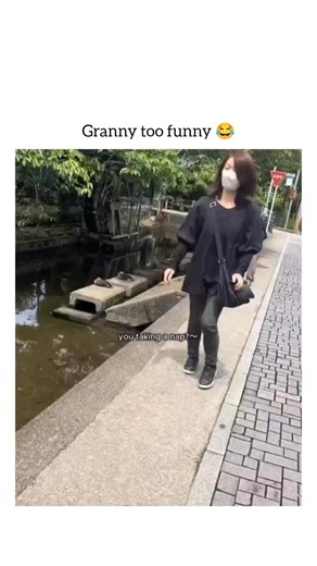 the laugh spot on Instagram: "The video shows an elderly woman walking alongside a small stream or canal, where there is a traditional wooden water wheel and some ducks resting on stepping stones in the water. The person filming asks the woman about the ducks, suggesting they are "taking a nap" (0:00-0:02). The woman then humorously asks, "don't they look delicious?" (0:03). The cameraman agrees, saying they "look delicious" and "look tasty" (0:04-0:07). The woman turns back to the camera, surpr