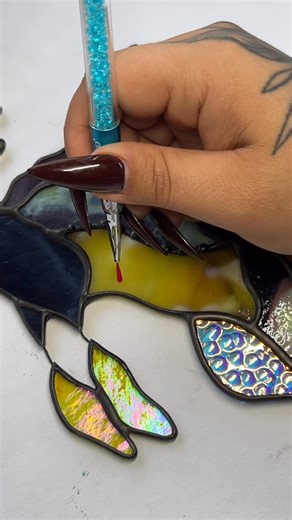 The intricacies of the weedy sea dragon are not something I take lightly!! This most recent colorway was a custom and I'm thinking of making another iteration for my holiday drop! Did I mention that's on December 6th yet? I disappeared for a bit, because there's so many things happening that I can't tell you about yet!! It's a lot. I'm overwhelmed and excited and so so so busy. The paint is vitrea 160 by pebeo. I will not be answering any further questions 🤣 #seadragon #stainedglass #painting #