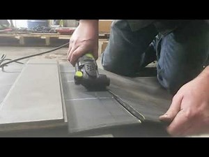 Oscillating tool cutting conveyor belting.