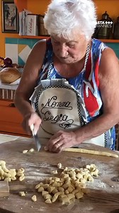 277K views · 3.4K reactions | She serves it with meatballs (polpette) and beef rolls (involtini) simmered in tomato sauce. A dish for Sunday’s. Giggina lives on the beautiful island of Ischia- do visit when you are next able to travel. #pastagrannies #gnocchi #ischia | Pasta Grannies | Facebook