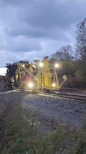 CSX track tramper machine in the early morning with all lights on! #shorts #work #railfan #training