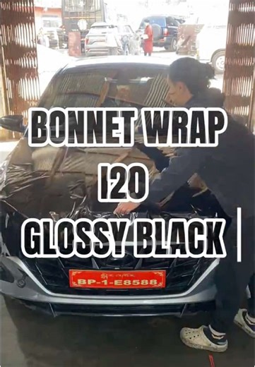 Glossy Black Bonnet Wrap on i20: A Stunning Modification