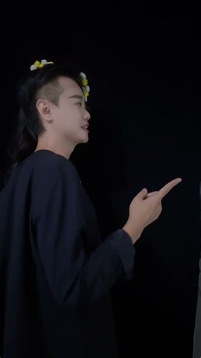 Young man transforms into a mysterious double-faced person, with an eerie yet sophisticated makeup.