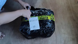 Unboxing a Parcel Containing a Hanger
