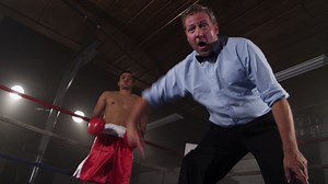Download Boxing referee counting out boxer for free