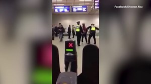 Police officers appears to BEAT man with a baton during arrest