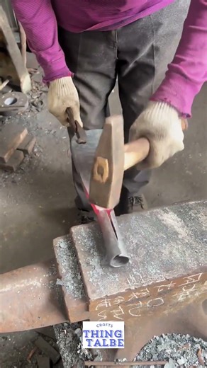 Crafting a traditional socketed sickle through precision power forging