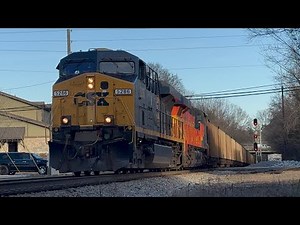 CSX #5286 pulling a empty coal train with the heritage unit Chessie System #1973