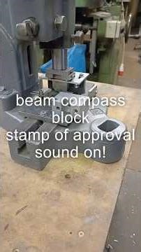 tooley park logo stamp being applied to the new beam compass blocks