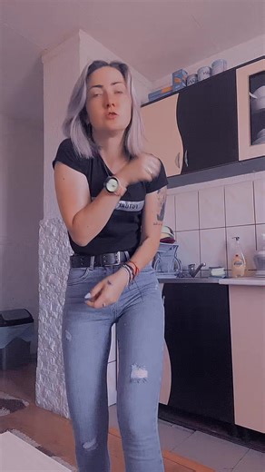 Rhythmic Dance Moves in a Modern Kitchen Setting