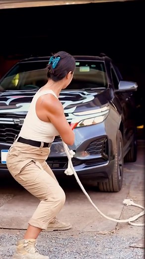Chinese Women Demonstrating Incredible Strength by Lifting Car