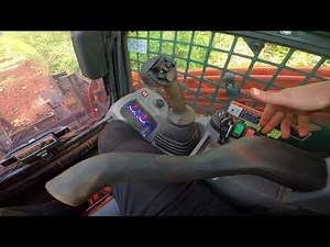 Kubota SVL75 Skid Steer run through the woods clearing, lifting logs and quick review.