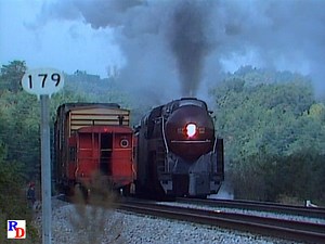 Norfolk Southern (Norfolk & Western) 611 is on a fall excursion with the Bluegrass RR Museum. It's seen crossing the Cumberland River (Lake Cumberland) at Burnside, KY and again meeting a freight at Greenwood. From the Pentrex show "Best of 1989 Railroading" https://rfd.video/Best1989 | Steam Giants