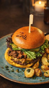 Mexican Burger 🍔 At Café Zalt in Copenhagen Chili marinated strips of steak - cheddar - salad - pickled cucumber - avocado cream - salsa - nachos chips. �Served with small oven-baked potatoes with pesto Book table in bio #mexicanburger#visitcopenhagen#copenhagenburgers#burgerlover#foodies | Zalt