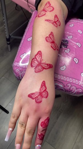 Red Butterfly Hand Tattoo Inspiration for Color Tattoo Artists