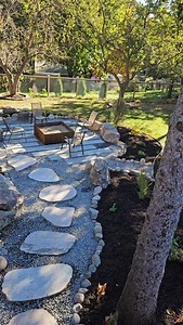 36 reactions | Dappled shade Engulfed in nature Grounded with stone This backyard is a gardener's playground | Drawn by Nature Landscaping | Facebook