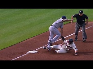 SD@ATL: Johnson slides under the tag at third