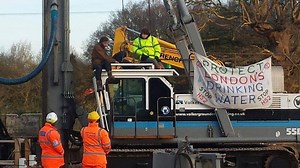 Extinction Rebellion protesters disrupt HS2 by climbing on drill | LBC