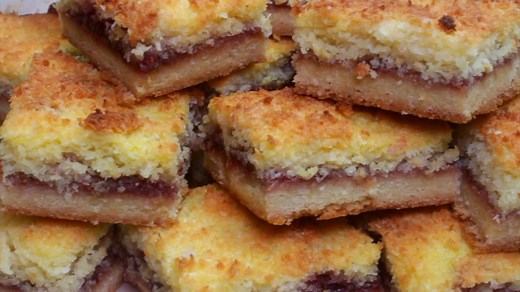 Is it even morning tea without raspbery jam coconut slice? Full recipe: https://bit.ly/2Po2yao | Taste.com.au