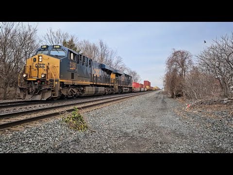 Long CSX intermodal train clears downtown North East, PA