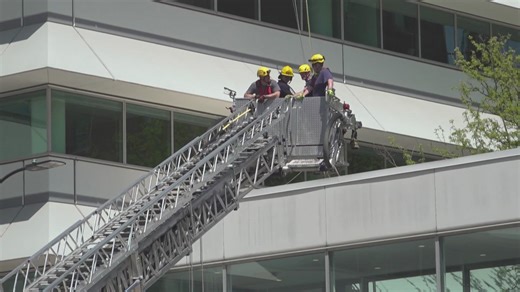 2 people rescued after window washing platform collapses in downtown Des Moines