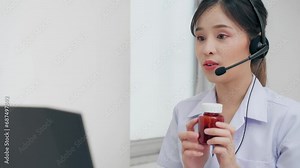 Professional asian doctor female talk video call via computer explain to sick patient how to using drug or recommend vitamin pills health medication at hospital. Technology online healthcare.