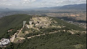 Sunny day aerial to Monte Alban Zapotec temple ruins in Oaxaca, Mexico