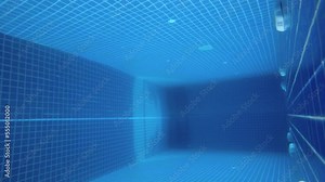 Clean and empty swimming pool filmed from below at daytime outdoors. Underwater footage of artificial water reservoir for leisure activities. Bottom view of touristic poolside with no people