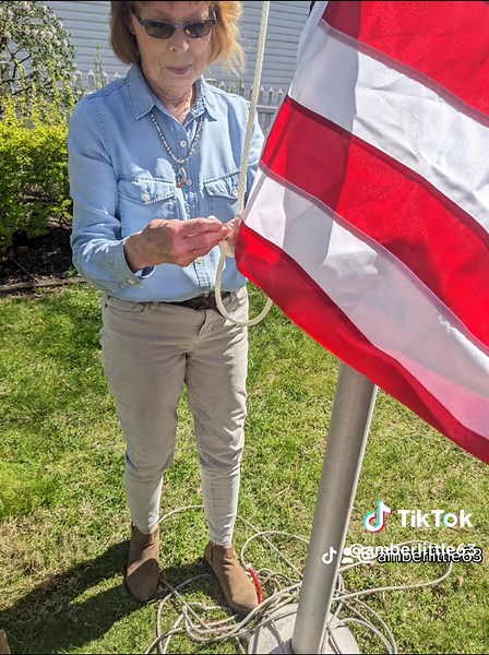 Changing a flagpole rope with Sylvi. This is an easy job if you do it while the old rope is on the pulley.