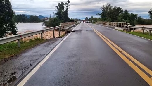 Bridge collapses and falls into river