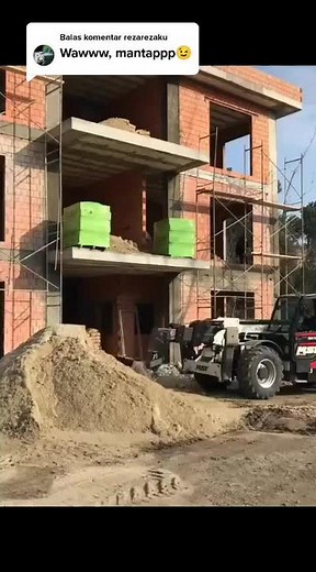 Telehandler in Action at Construction Site