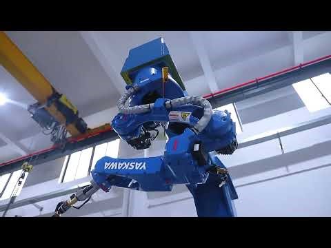 Track and headstock positioner robot workcell with abjustable tailstock