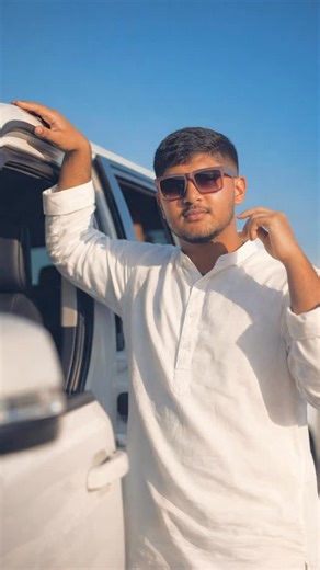 ❤️𝔡𝔦𝔳𝔶𝔞𝔫𝔰𝔥𝔲❤️ on Instagram: "❤️💋 #explorepage #reels #india #viral #trendingreels Create an ultra-realistic cinematic vertical reel of a stylish young man walking slowly toward the camera in golden hour sunlight. His hair is slightly messy, face sharp and confident, wearing a black leather jacket over a white T-shirt and dark sunglasses. The background is a blurred city street with moving cars and light flares. Wind gently moves his hair and jacket. The camera is in slow motion with sh