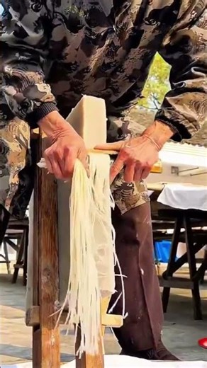 A man who is scraping a special material neatly