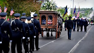 AN EMOTIONAL FAREWELL: Kansas City said goodbye Wednesday to Overland Park Police Department Officer Mike Mosher. Hundreds came out to show their support for the "community's fallen hero." t.ly/MxmX | KMBC 9
