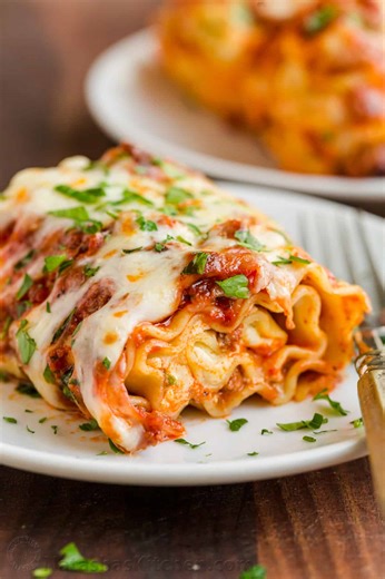 My Lasagna Roll Ups recipe takes the best of classic Lasagna but makes it easier to serve, faster to bake, and ready to serve right away! (Recipe in comments) | NatashasKitchen.com