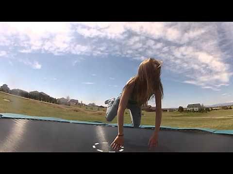 Cute Girl Jumps on Trampoline in Slow Motion