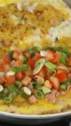 A layer of crispy hash browns on the outside of your next omelet?! 💥 You get crusty potatoes in every bite! Get the recipe for this Hash Brown Omelet: https://foodtv.com/3rW4P01 | Food Network