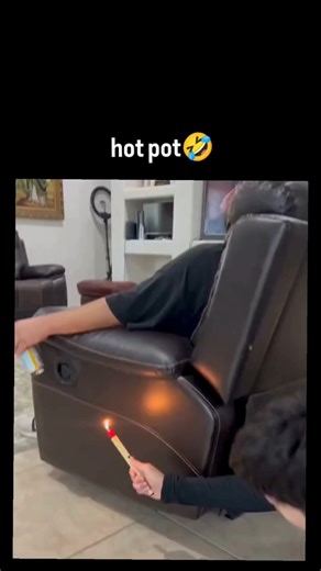 Multiverse ™🇺🇸 on Instagram: "The post features a humorous video of someone inserting a lit chafing fuel can into a recliner's cup holder as an absurd DIY heater, punning on "hot pot" while quoting a call for random videos, amassing over 5.8 million views in under 24 hours due to its relatable winter whimsy. , the clip sparks playful Indonesian replies joking about the "heat" (e.g., "panas banget lah" meaning "super hot"), highlighting cultural humor around everyday hacks in tropical climates 