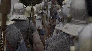 Picture depicting a historical battle scene featuring soldiers clad in armor ready for combat