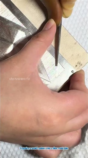 Engraving a scratch pattern onto a silver metal plate