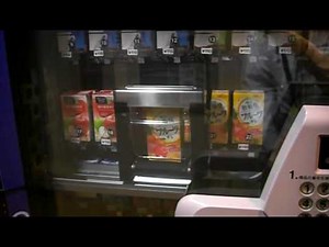 紙パック飲料 自動販売機 購入シーン 明治乳業ブリックパック