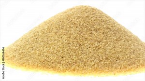 Panning left to right of fine coarse bulgur on white background.
